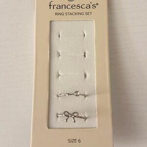 Francesca’s silver stacking rings - bow